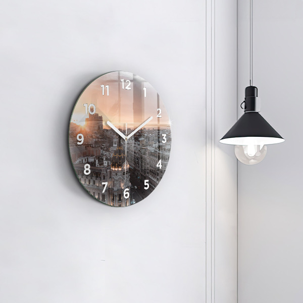Round glass clock Cities at sunset