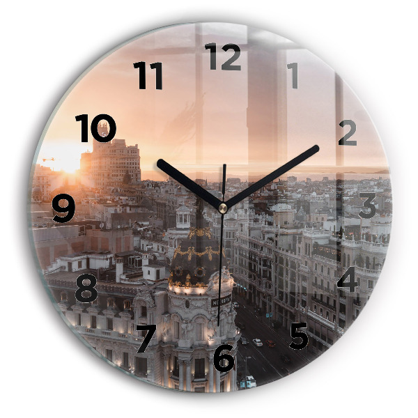 Round glass clock Cities at sunset