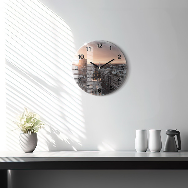 Round glass clock Cities at sunset