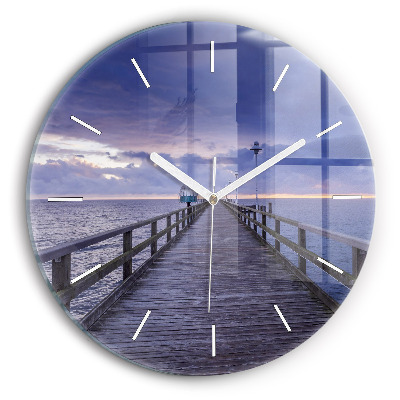 Round glass clock Pier on the Baltic Sea