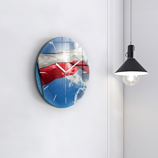 Round glass clock The Polish flag against the sky