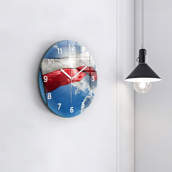 Round glass clock The Polish flag against the sky