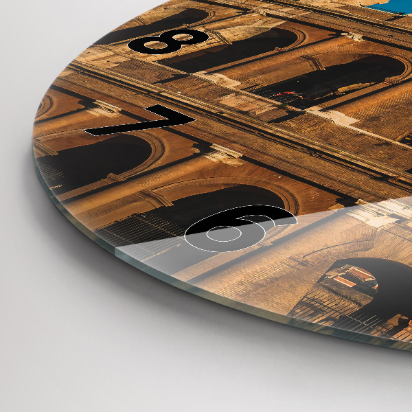 Round glass clock The Colosseum in Italy