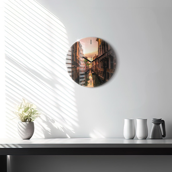 Round glass clock View of the canal in the city