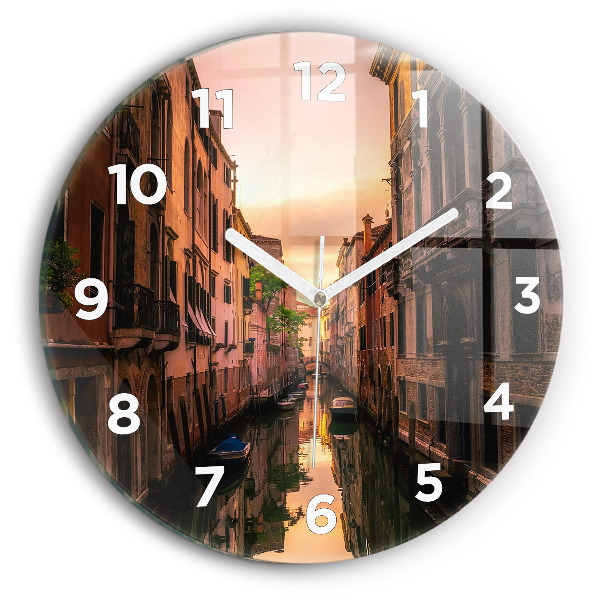 Round glass clock View of the canal in the city