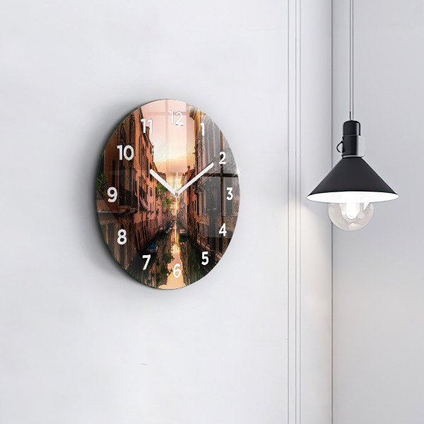Round glass clock View of the canal in the city