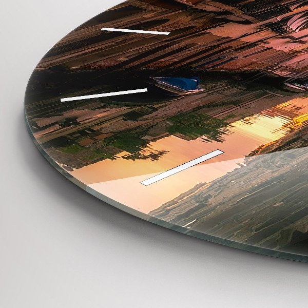Round glass clock View of the canal in the city