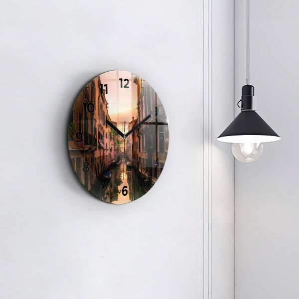 Round glass clock View of the canal in the city