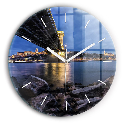 Round glass clock Rocky shore under the bridge