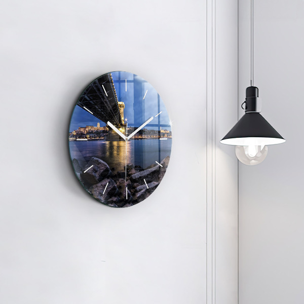 Round glass clock Rocky shore under the bridge