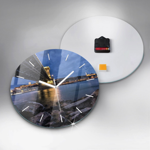 Round glass clock Rocky shore under the bridge