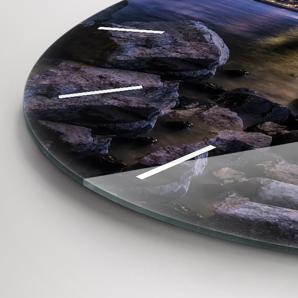 Round glass clock Rocky shore under the bridge