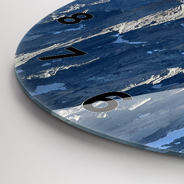 Round glass clock Alps Mountains in Winter