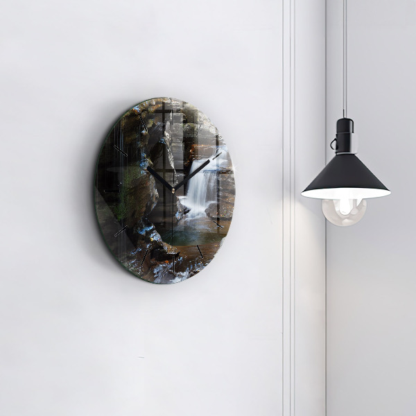 Round glass clock Waterfall and rocks of Iceland