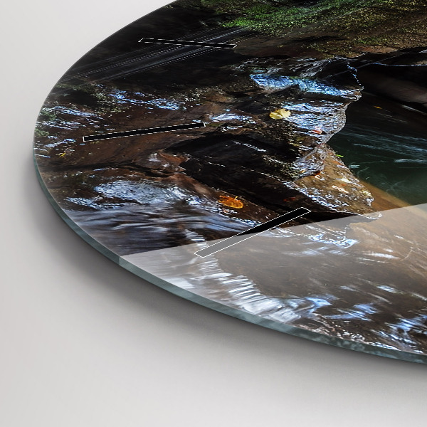 Round glass clock Waterfall and rocks of Iceland