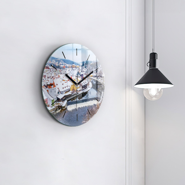 Round glass clock Panorama of the city in winter