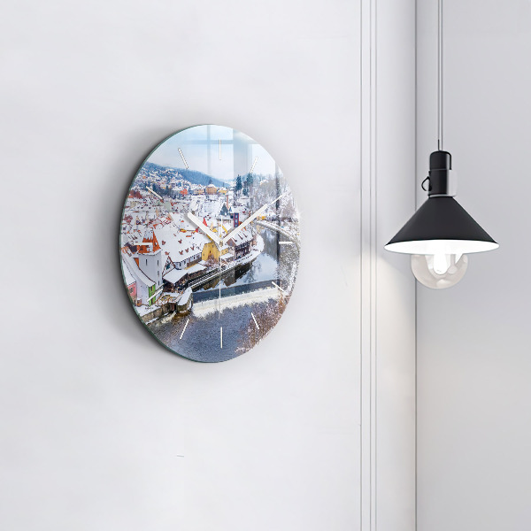 Round glass clock Panorama of the city in winter