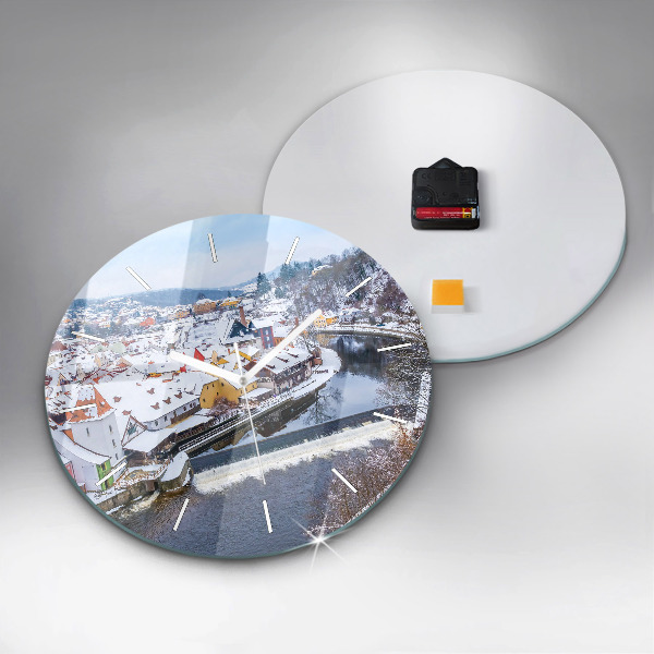 Round glass clock Panorama of the city in winter