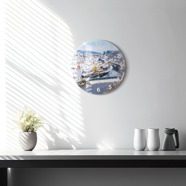 Round glass clock Panorama of the city in winter