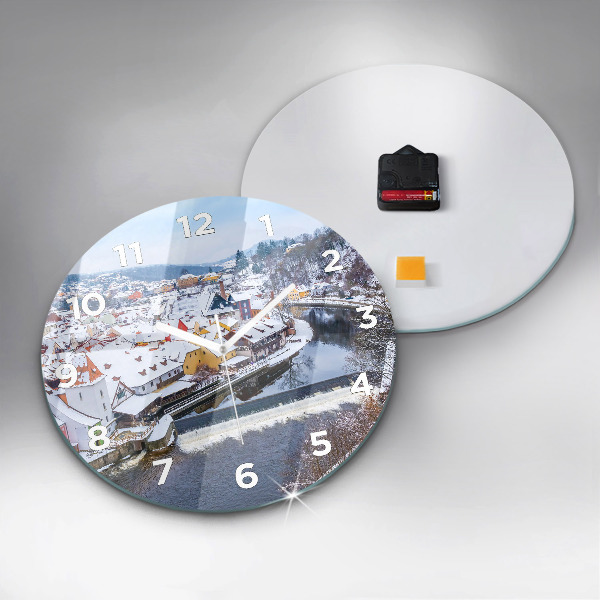 Round glass clock Panorama of the city in winter