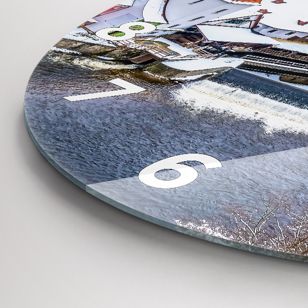 Round glass clock Panorama of the city in winter