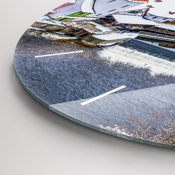 Round glass clock Panorama of the city in winter