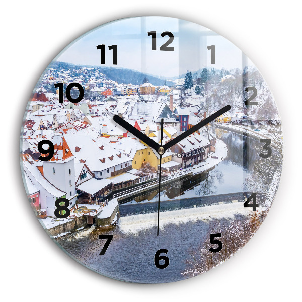 Round glass clock Panorama of the city in winter