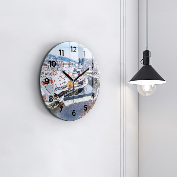 Round glass clock Panorama of the city in winter