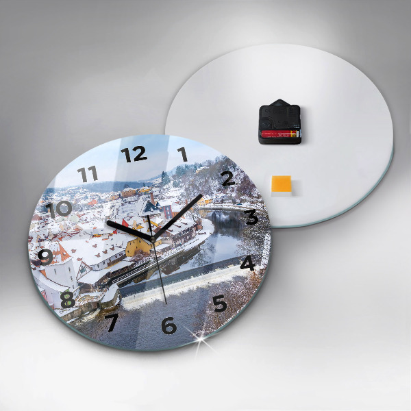 Round glass clock Panorama of the city in winter