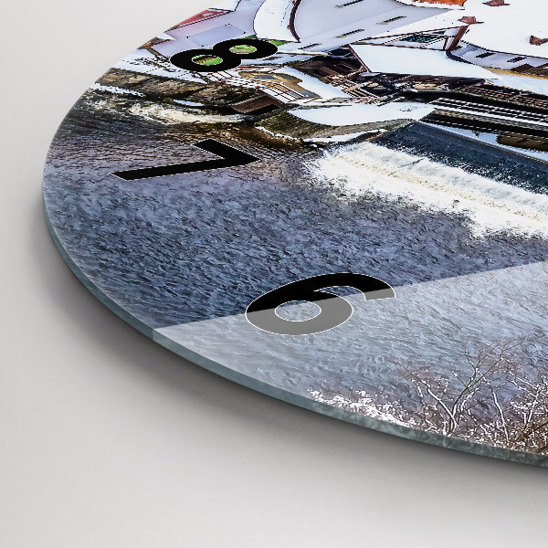 Round glass clock Panorama of the city in winter