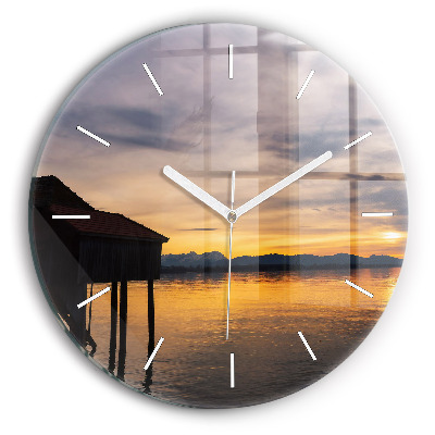 Round glass clock Sunset over the lake