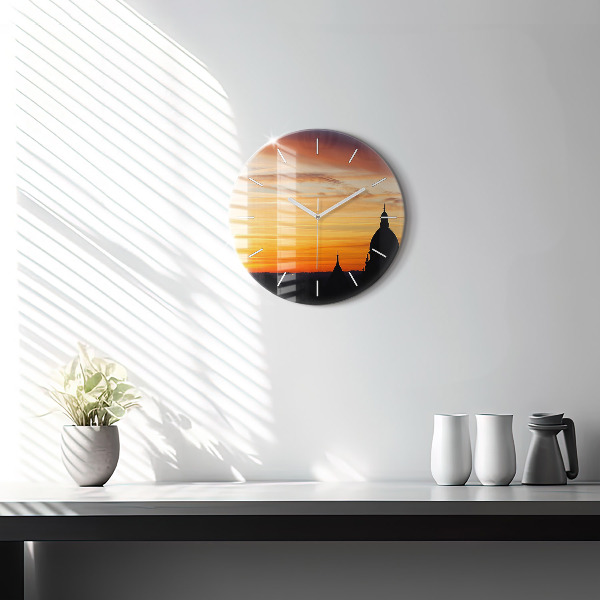 Round glass clock Building and sunset