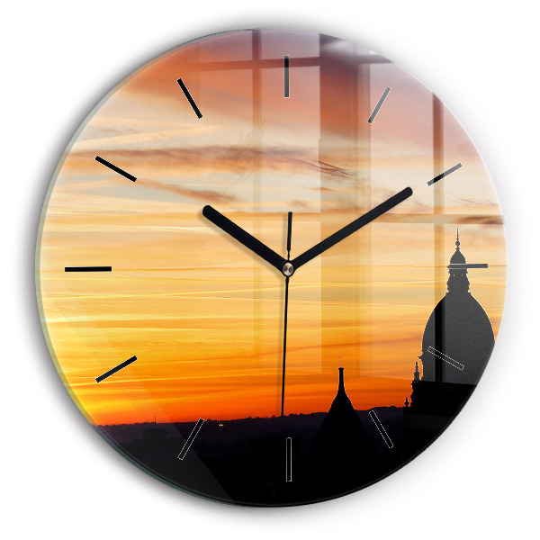 Round glass clock Building and sunset