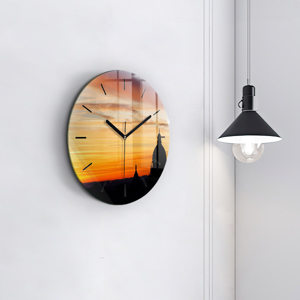 Round glass clock Building and sunset