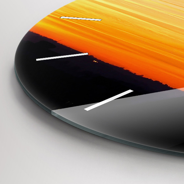 Round glass clock Building and sunset