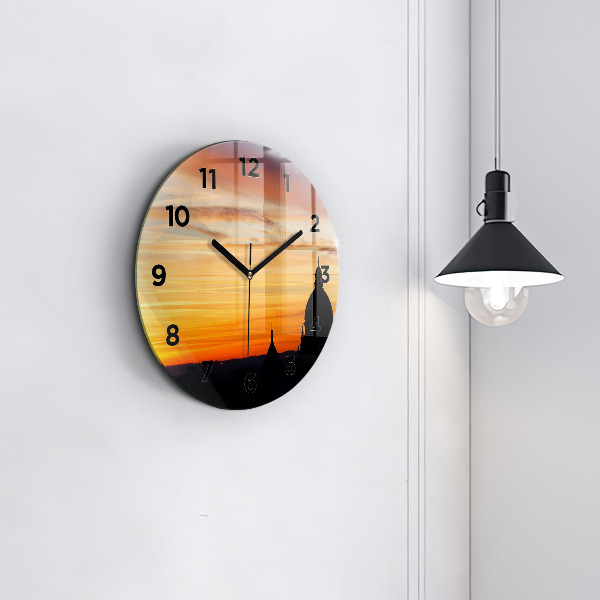 Round glass clock Building and sunset