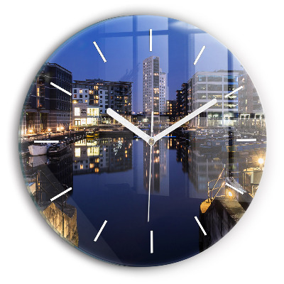 Round glass clock The city lit up at night
