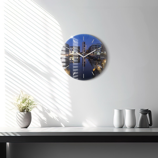 Round glass clock The city lit up at night