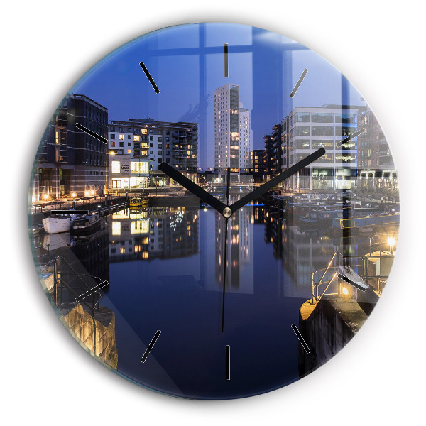 Round glass clock The city lit up at night