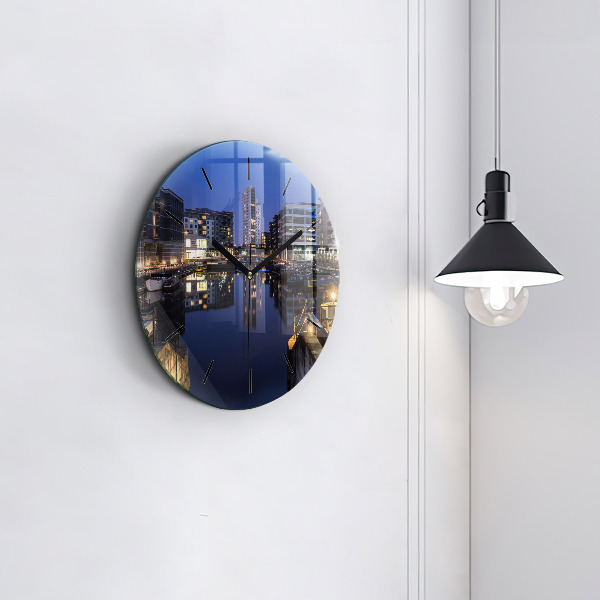 Round glass clock The city lit up at night