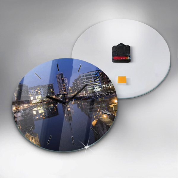 Round glass clock The city lit up at night