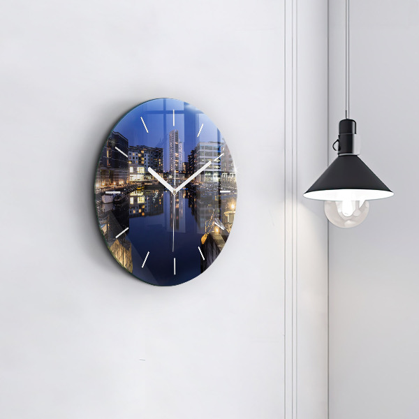 Round glass clock The city lit up at night