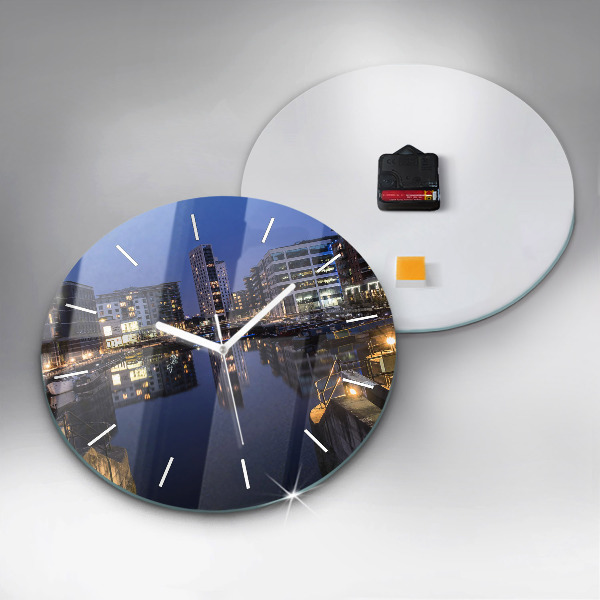 Round glass clock The city lit up at night