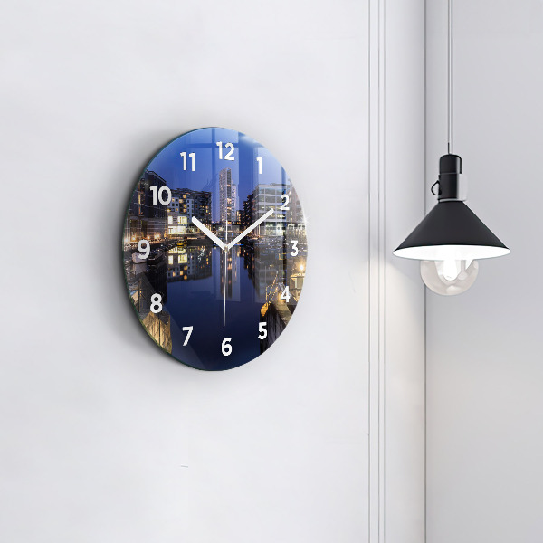 Round glass clock The city lit up at night