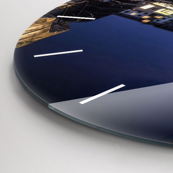 Round glass clock The city lit up at night