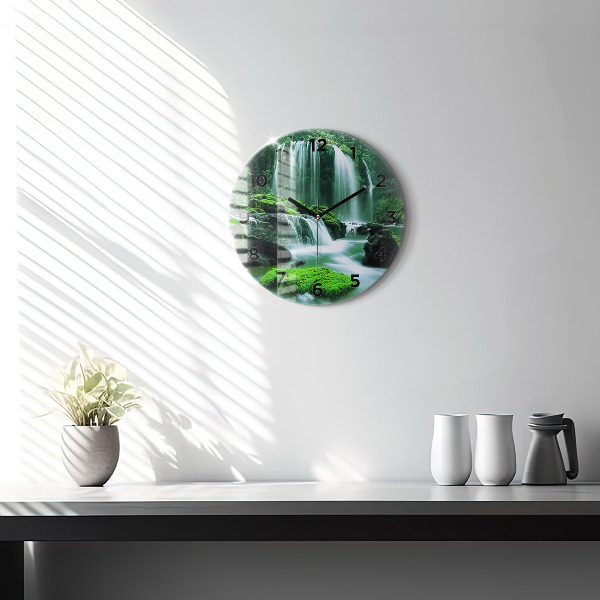 Round glass clock Waterfall among the moss