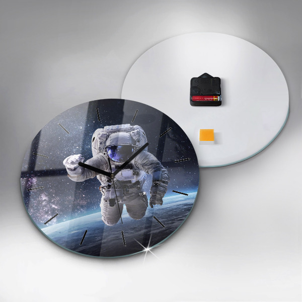 Round glass clock Astronaut above the earth
