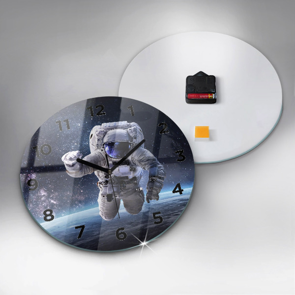 Round glass clock Astronaut above the earth