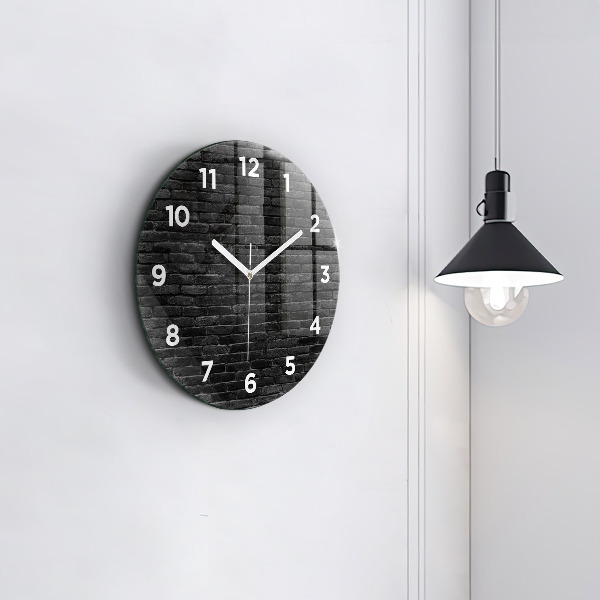 Round glass clock Dark brick wall