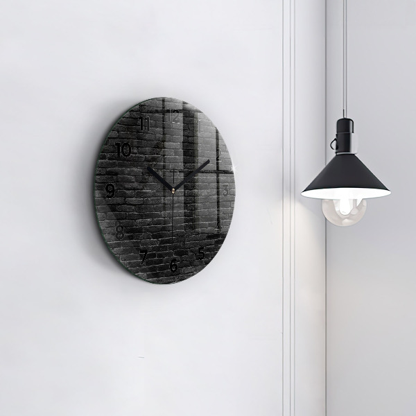 Round glass clock Dark brick wall